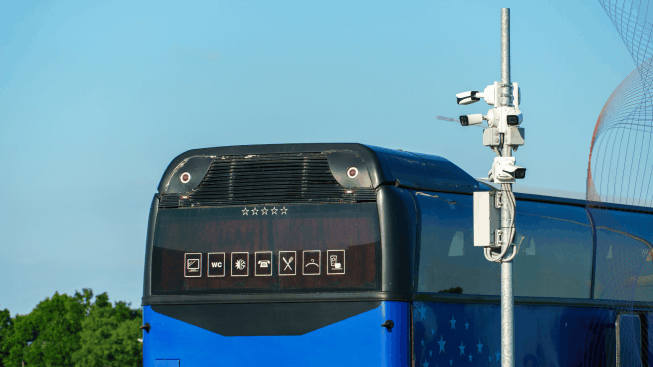 Security cameras at the bus stop in the parking lot outdoor, surveillance cameras are installed on a metal pole