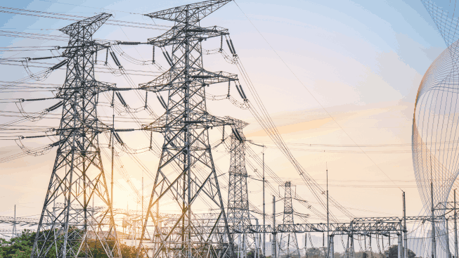 High pressure wire tower at sunset at dusk