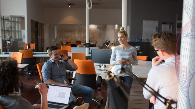 Group of young people discussing the business plan in the office