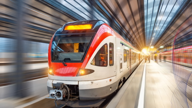 Passenger high-speed train with motion blur in train station