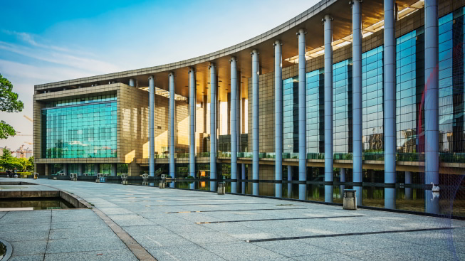 A building with columns and a walkway.